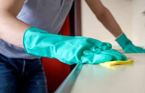 Staff member handling carpet cleaning equipment with care